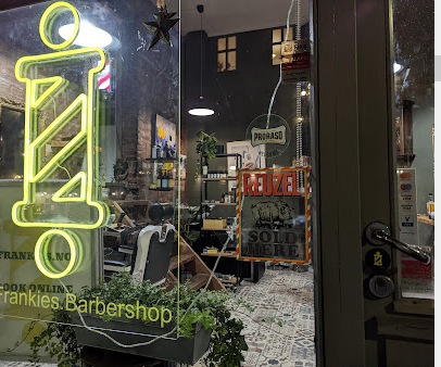 Barber working on client